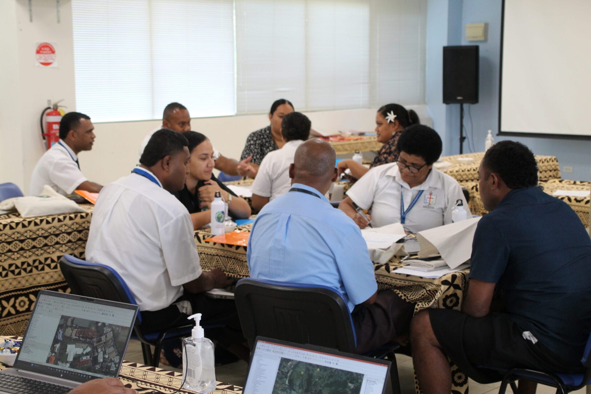 Anglican CIVA and QGIS training participants working together